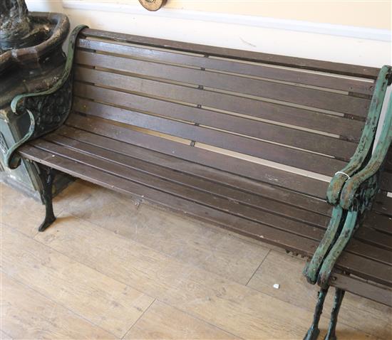 A wrought iron garden bench W.128cm